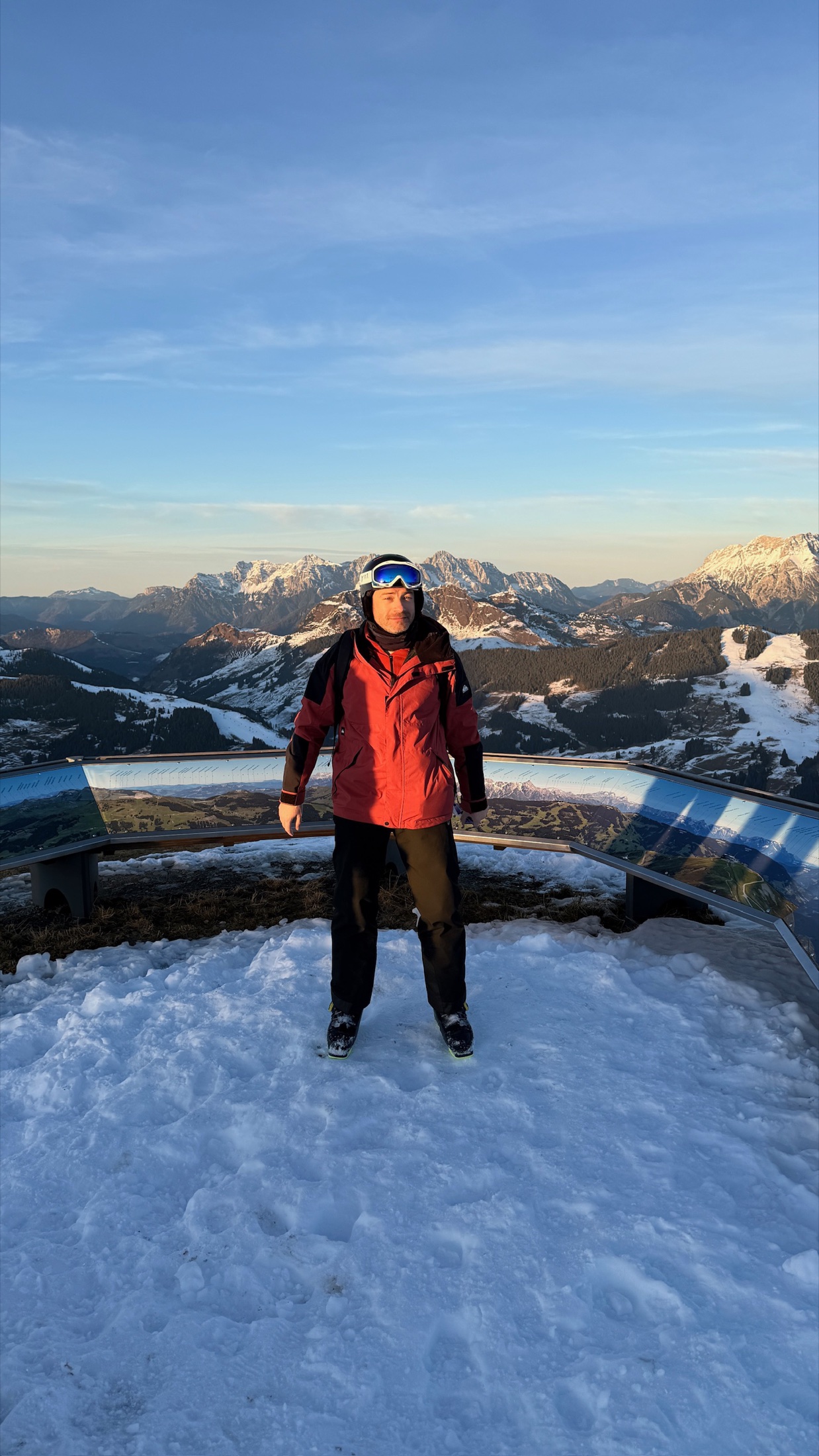 Tom at a snowy mountain viewpoint at sunset